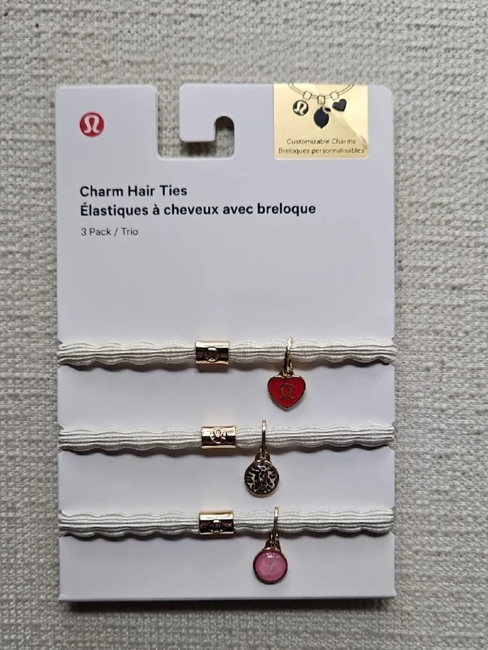 lululemon athletica Charm Hair Ties Trio — White Bands with Red & Pink Charms